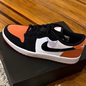 Nike Golf Jordan 1s Black and Orange Low-Top Sneakers
